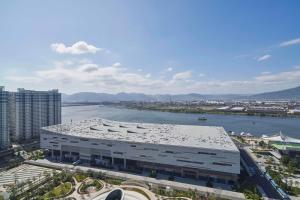 an aerial view of a large building next to a river at Fuzhou Marriott Hotel Riverside in Fuzhou