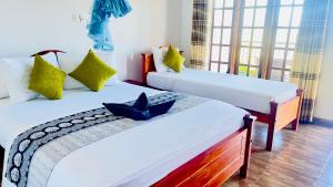 Katil atau katil-katil dalam bilik di Pearl View Guesthouse