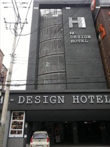 a hotel with a car parked in front of it at Hi Design Hotel in Busan
