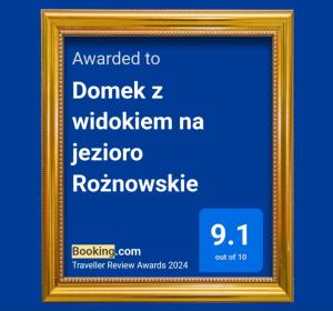 a picture of a gold picture frame on a blue background at Domek z widokiem na jezioro Rożnowskie 