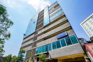 a tall building with windows on the side of it at The Azure in Mumbai