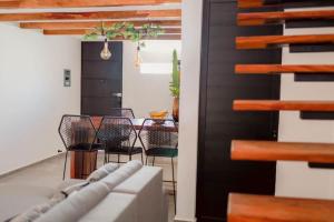 a living room with a couch and a table and chairs at CasaVaras in Las Varas