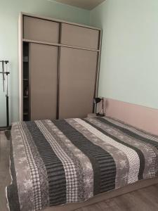 Postel nebo postele na pokoji v ubytování Comfortable Apartment Balakhvani + 1 fotografie