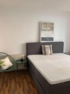 a bedroom with a bed and a side table at Cosy Apartment nearly City Hall Vienna and Subway in Vienna