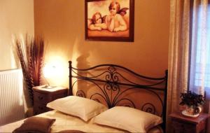 Postel nebo postele na pokoji v ubytování Garden Villa