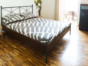 Кровать или кровати в номере I Tetti Napoli