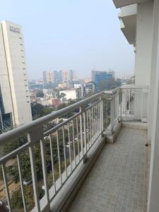 a balcony with a view of a city at The Awadh Retreat in Lucknow