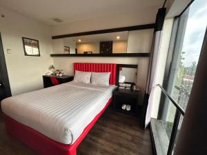 Postelja oz. postelje v sobi nastanitve Kalya Hotel Bandung Dago
