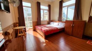 Postel nebo postele na pokoji v ubytování Đông Đức Hostel Đà Lạt