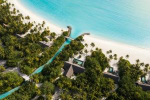 an aerial view of the resort and the beach at One&Only Reethi Rah in Reethi Rah