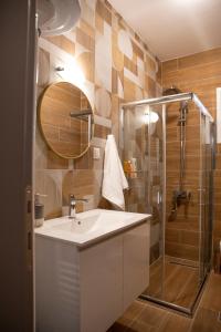 a bathroom with a sink and a shower at Panagiotidis lake house in Kastoria