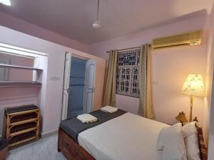 Кровать или кровати в номере Kinara 2 bhk Villa