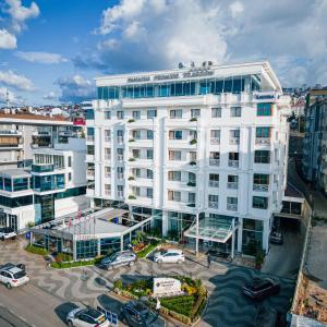 an aerial view of a white building in a city at Panagia Premier Trabzon in Trabzon