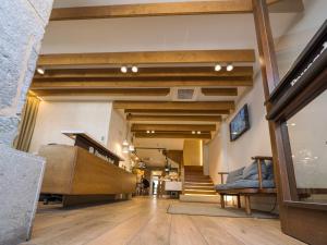 a hallway of a store with a bed and stairs at Hotel Pousada Real in Caldas de Reis