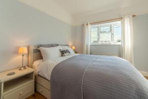 Voodi või voodid majutusasutuse Barnwell Cottage toas