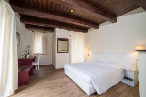 Ліжко або ліжка в номері Il Borgo Ospitale - Albergo Diffuso