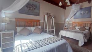 Llit o llits en una habitació de Tafelkop Keisie Self Catering Cottage