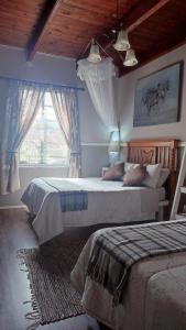 Llit o llits en una habitació de Tafelkop Keisie Self Catering Cottage