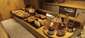 a kitchen counter with some food and drinks on it at IBIS BUDGET Biarritz - Anglet in Anglet