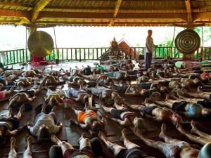 a large group of people laying on the floor in a room at Udara Bali Yoga Detox & Spa in Canggu