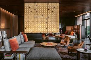 a living room with a couch and a table at Bulgari Hotel Shanghai in Shanghai