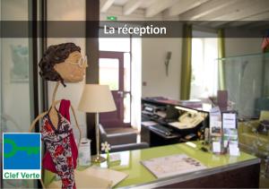 a bust of a woman sitting on a desk in an office at HÔTEL LA FERME DE BOURRAN - écoresponsable parking gratuit in Rodez