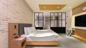 Postelja oz. postelje v sobi nastanitve Hotel Schweizer Dorf Cheonan