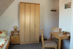 Ένα ή περισσότερα κρεβάτια σε δωμάτιο στο Gästezimmer am Tiefwarensee