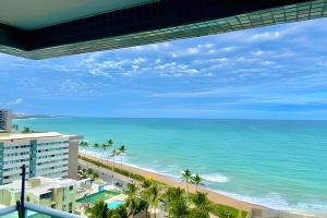 a view of the ocean from the balcony of a resort at Studios Premium RN in Maceió