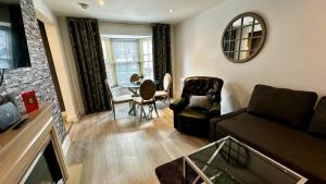 a living room with a couch and a table at One Bedroom Flat Town Centre Colchester in Colchester