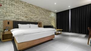 Postelja oz. postelje v sobi nastanitve Hotel Schweizer Dorf Cheonan