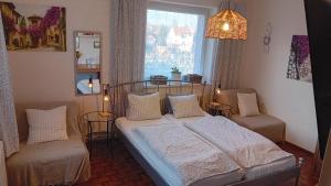 Un pat sau paturi într-o cameră la Penzión Vilka Podhájčanka