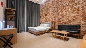Postelja oz. postelje v sobi nastanitve Hotel Schweizer Dorf Cheonan
