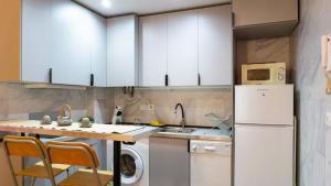 Kuchyňa alebo kuchynka v ubytovaní Love Apartment Málaga Center