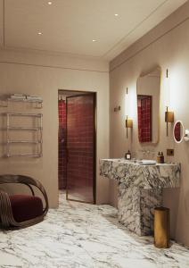 a bathroom with a sink and a mirror at Palazzo Talìa - Small Luxury Hotels of the World in Rome