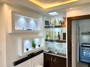 a room with a wine cellar with bottles on shelves at Moderno Penthouse 