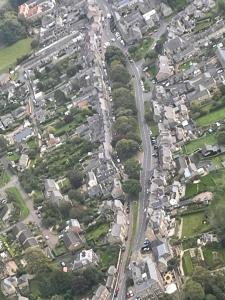 an aerial view of a city with houses at Turks Head Rothbury in Rothbury