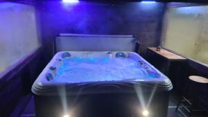 a blue bath tub in a room with smoke at Barn near Colne for Leisure or Business in Colne
