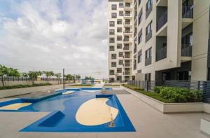 a swimming pool in the middle of a building at Studio Converted to 1BDR in The Nook Close to Metro in Dubai