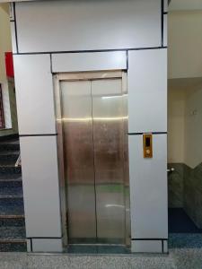 a elevator in a building with its door open at Shri Girraj Residency in Mathura