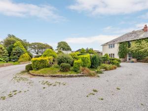 an estate with a garden in front of a house at 8 Bed in Clovelly 85428 in Woolfardisworthy