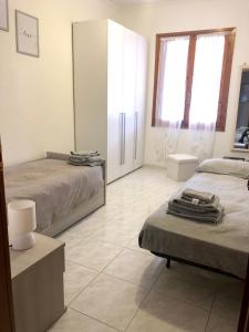 A bed or beds in a room at Appartamento “Casa Losa” Citra 008063-LT-0086