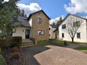 a house with a brick driveway in front of it at 3 Bed in Ullswater 85896 in Penruddock