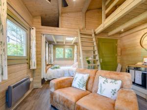 a living room with a couch in a log cabin at 1 Bed in Moffat 85282 in Moffat