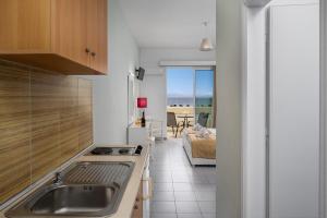 A kitchen or kitchenette at Bayside Hotel Katsaras