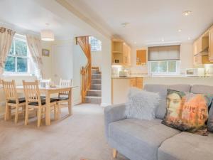 a living room and kitchen with a couch and a table at 2 Bed in Wasdale SZ413 in Nether Wasdale