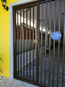 a door with a gate in front of a building at Near Casa Bacardi, 5 beds, Sleeps 10, Beach Town, Unit 1 in Catano