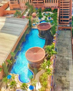 an overhead view of a pool at a resort at Regal Residences At Berjaya Times Square in Kuala Lumpur