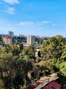 a view of a city with trees and buildings at Voyager 002 in Nairobi