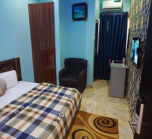 Joclarif Hotel and Suites客房内的一张或多张床位